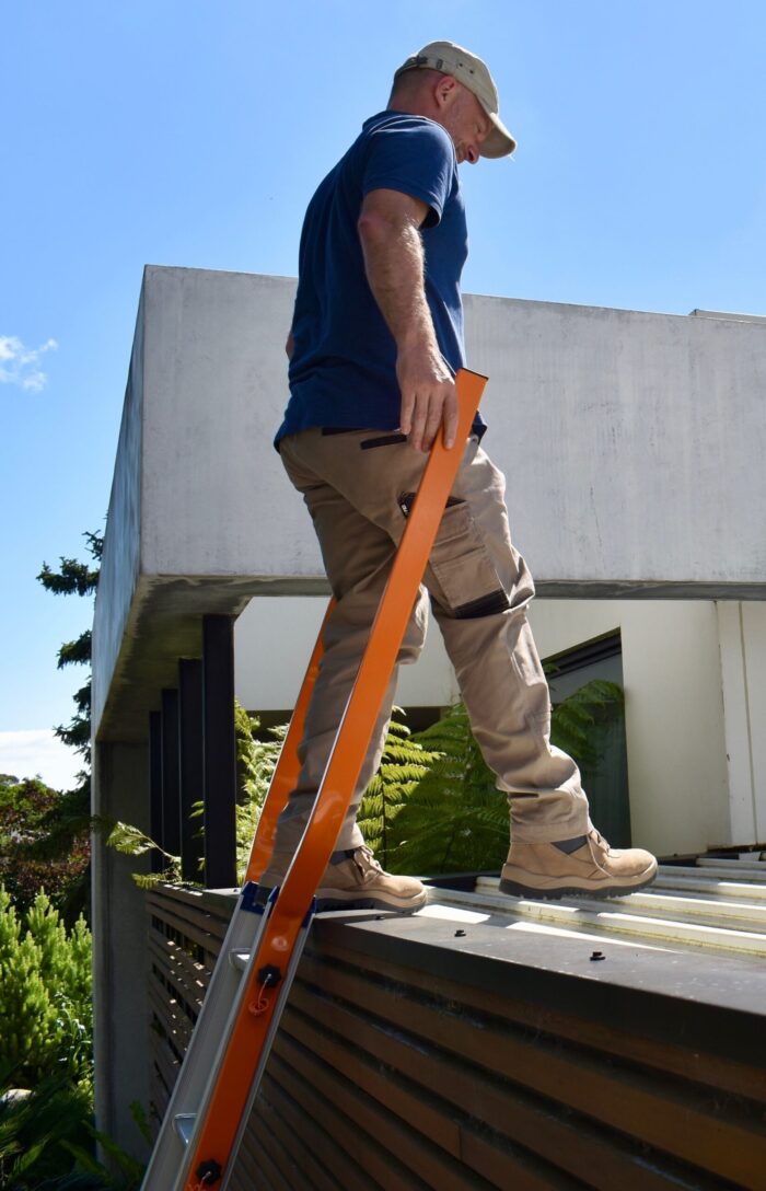 Walking safely from extension ladder onto roof using Little Jumbo Ladders Walk Thru Hand railss