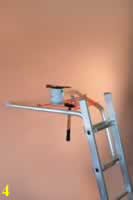 waku telescopic ladder accessory wall standoff with paint tin and hammer.jpg