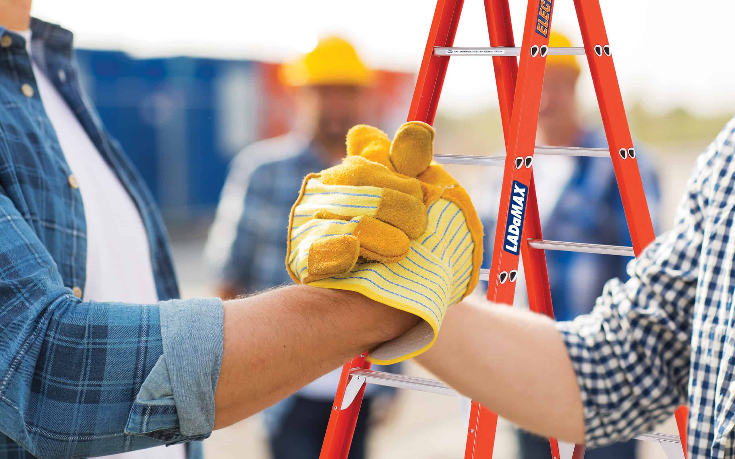 Men shaking hands with LADAMAX Double Sided Ladder in background