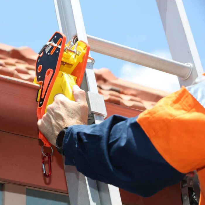 Lock Jaw Ladder Grip securing a ladder to a gutter – ladder grip for enhanced safety and compliance