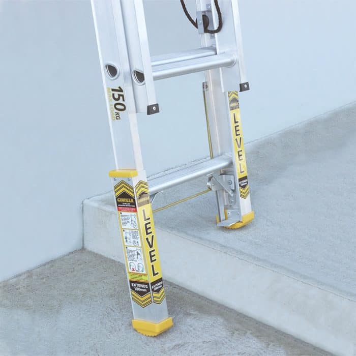 Gorilla Aluminium Extension Ladder with Leveller demonstrated on uneven ground